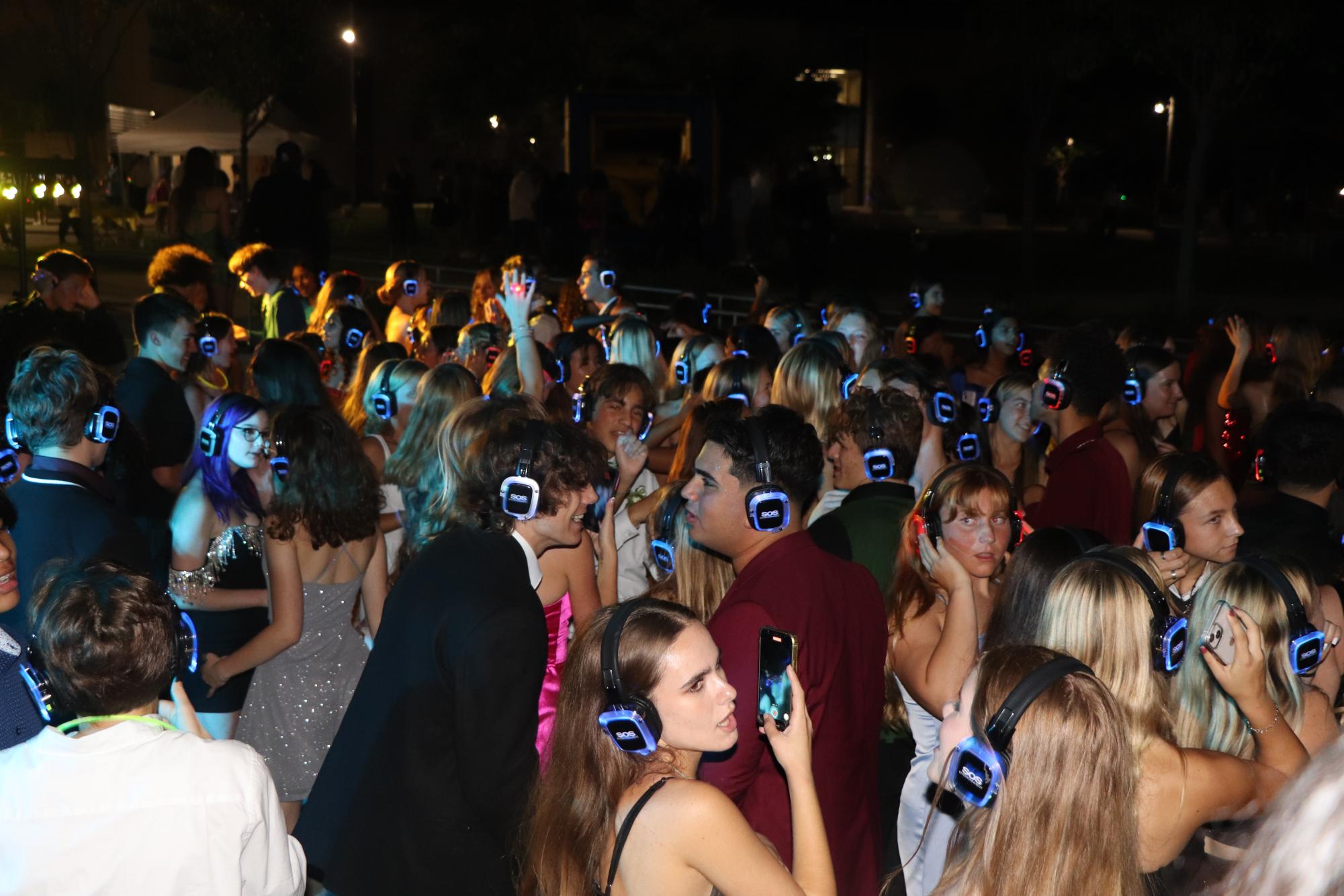 Students participating in the silent disco in the quad on Oct. 7 during Homecoming.