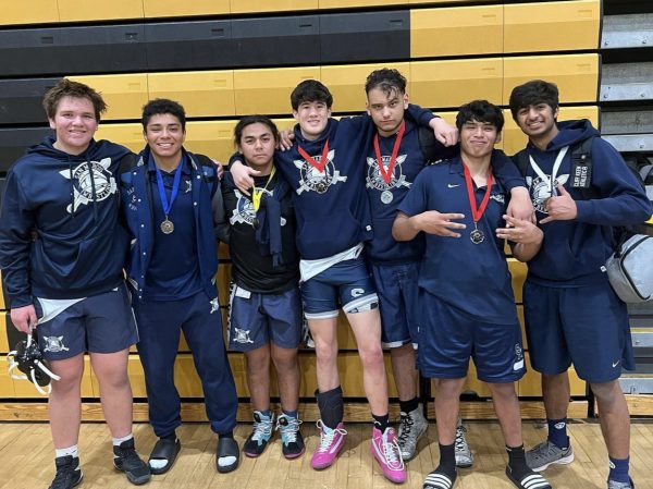 SMHS wrestling team photographed with their medals after competing in the wrestling tournament.